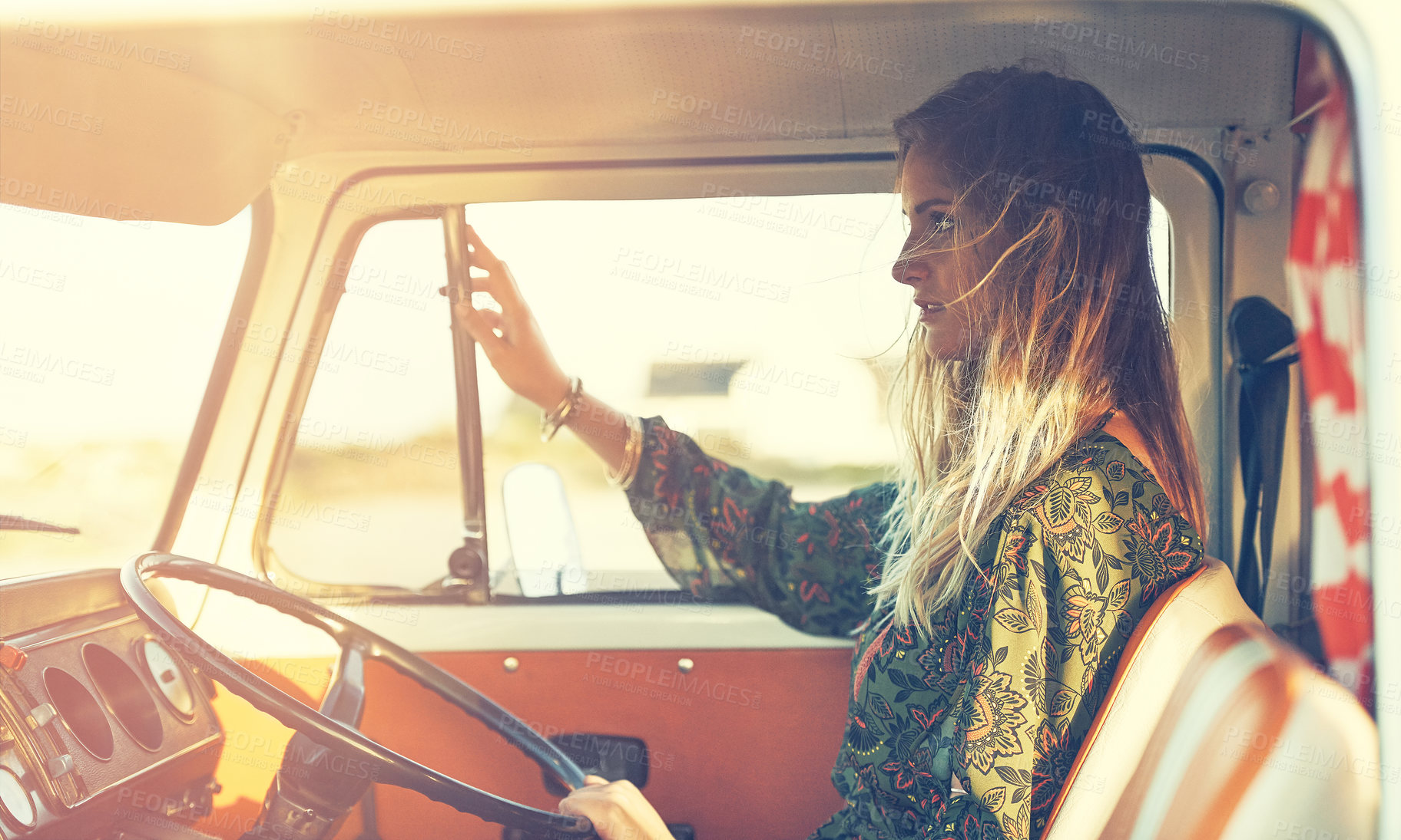 Buy stock photo Shot of a gorgeous young woman enjoying a roadtrip on her own