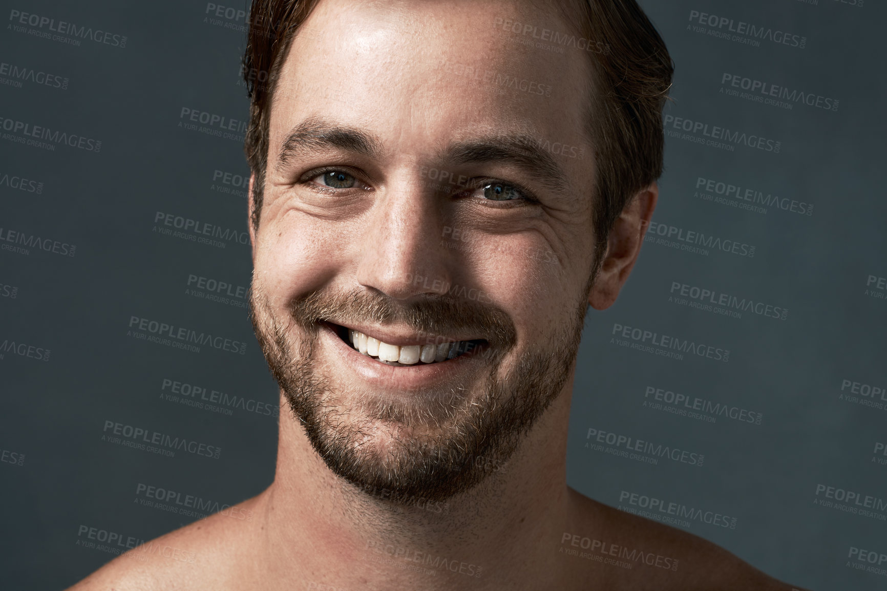 Buy stock photo Cropped portrait of a handsome young man against a grey background