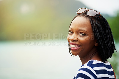 Buy stock photo Portrait of a smiling young woman standing outside in Thailand