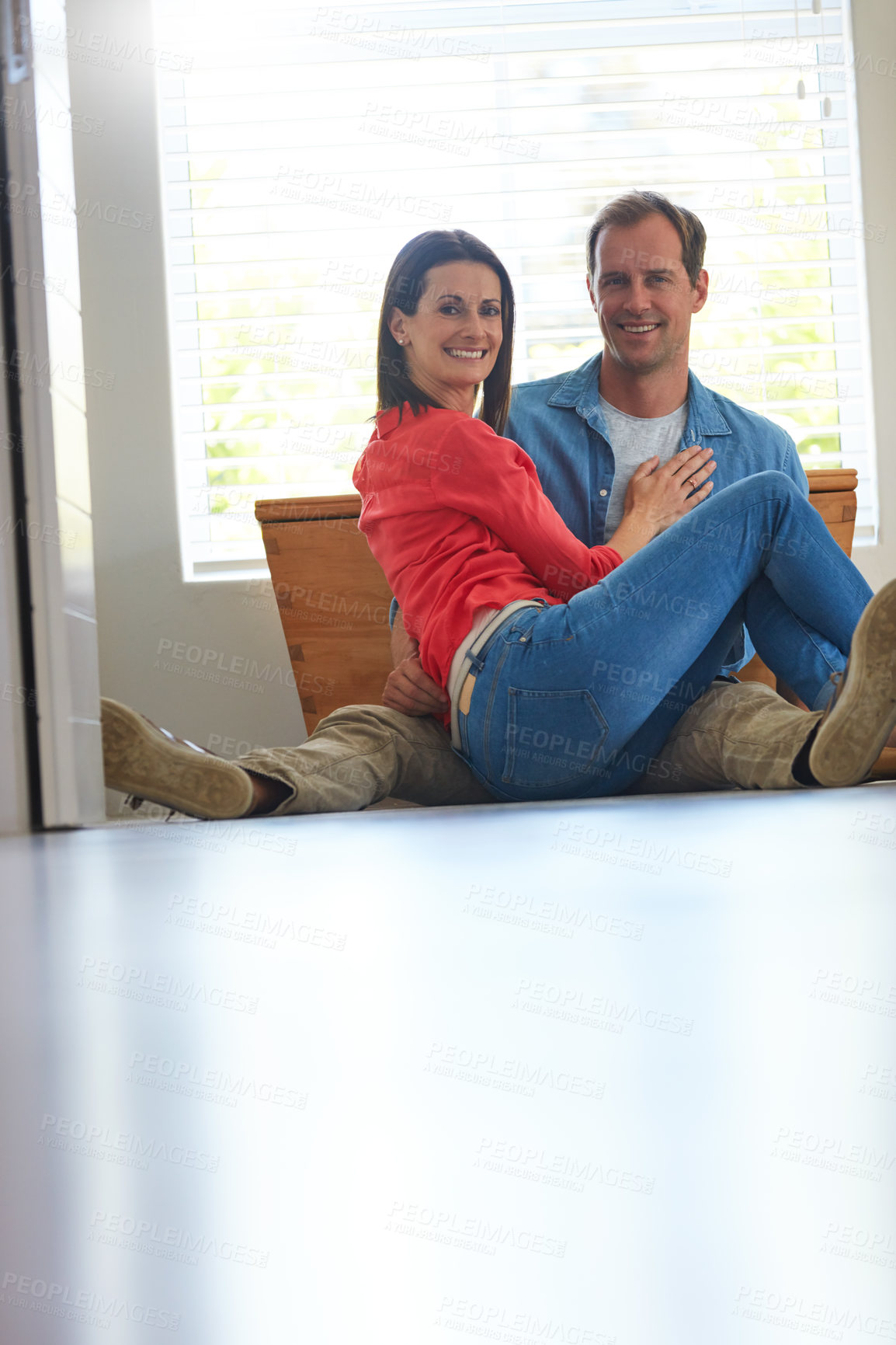 Buy stock photo Portrait of a mature couple relaxing together at home