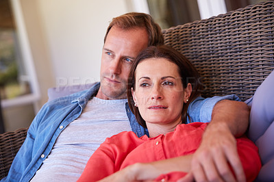 Buy stock photo Shot of a mature couple relaxing together at home
