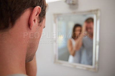 Buy stock photo Shot of a distraught man being comforted by his wife at home