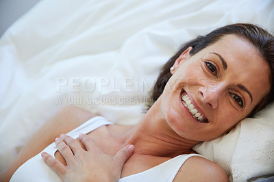 Buy stock photo Portrait of a woman relaxing in bed