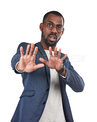 Buy stock photo Shock, stop and portrait of a black man in a studio with a scared, fear and terrified face expression. Upset, mad and African male model with a defensive hand gesture isolated by a white background.