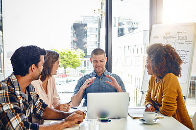 Buy stock photo Cropped shot of a team of designers having a meeting in an office