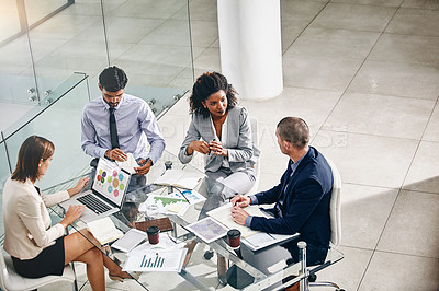 Buy stock photo Shot of a group of businesspeople having a meeting
