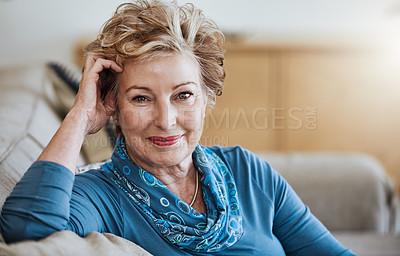 Buy stock photo Portrait of an attractive senior woman relaxing on the sofa at home