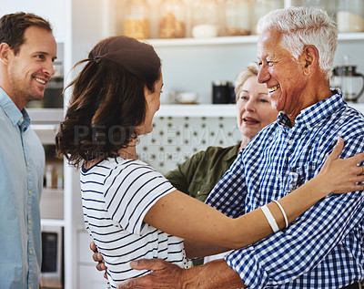 Buy stock photo Cropped shot of a couple visiting their parents at home