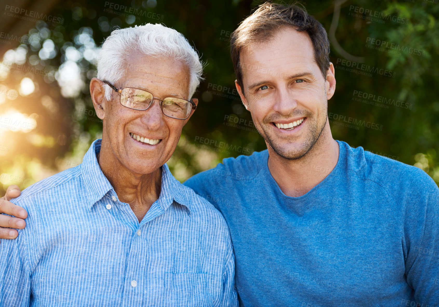 Buy stock photo Portrait of happy man posing outside with his mature father