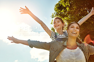 Buy stock photo Shot of a mother and her daughter bonding together outdoors