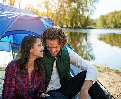 Buy stock photo Shot of an adventurous couple out camping together