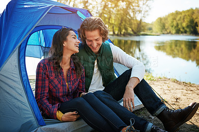 Buy stock photo Shot of an adventurous couple out camping together