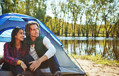 Buy stock photo Shot of an adventurous couple out camping together