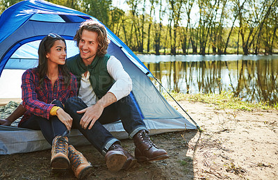 Buy stock photo Shot of an adventurous couple out camping together