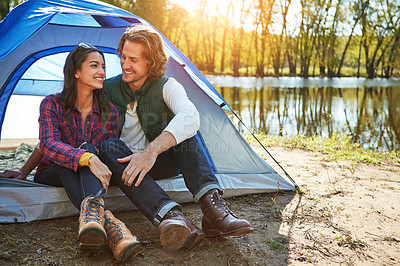 Buy stock photo Shot of an adventurous couple out camping together