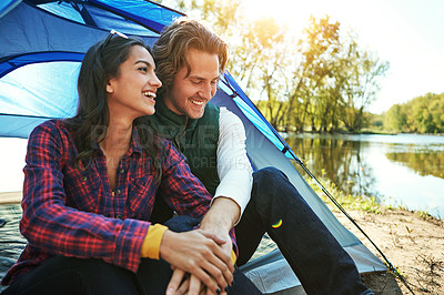 Buy stock photo Camping, couple and holding hands with love on holiday and happiness together on adventure in woods. People, embrace or relax outdoor in nature with funny chat on vacation or travel to river or lake