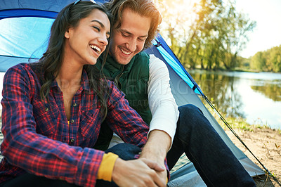 Buy stock photo Camping, couple and laughing in tent on holiday with love and happiness together on adventure in woods. People, holding hands or relax outdoor in nature on vacation or travel to river in forest