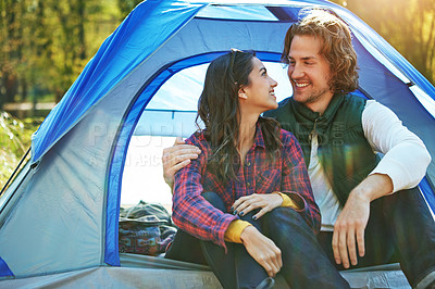 Buy stock photo Couple, hug and relax in tent or camping with love and happiness together on adventure in woods. People, embrace or outdoor journey in nature, forest or chat on vacation with travel in marriage