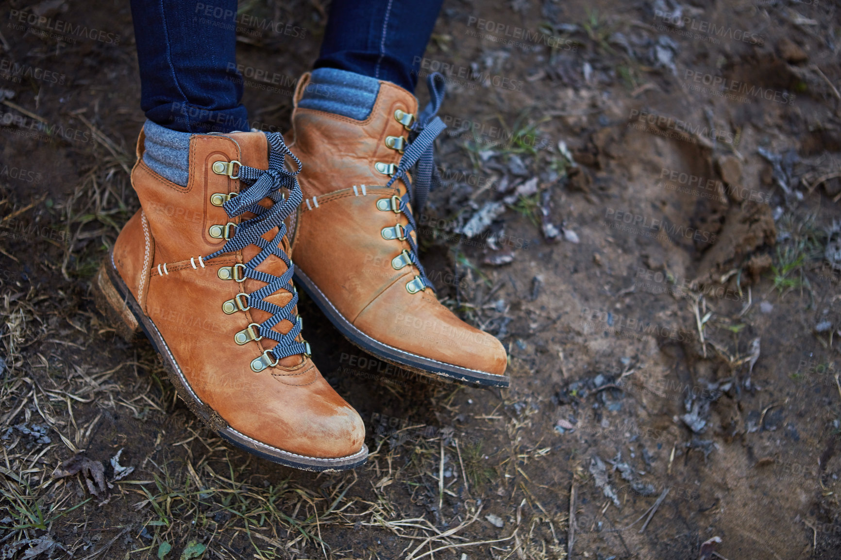 Buy stock photo Low angle shot of a woman's shoes while out hiking