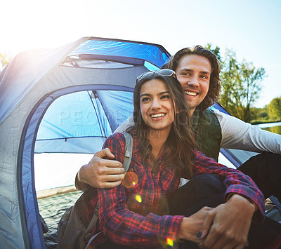 Buy stock photo Shot of an adventurous young couple at their campsite