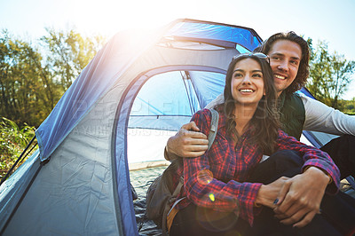 Buy stock photo Shot of an adventurous young couple at their campsite