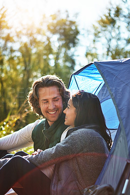 Buy stock photo Shot of an adventurous young couple at their campsite