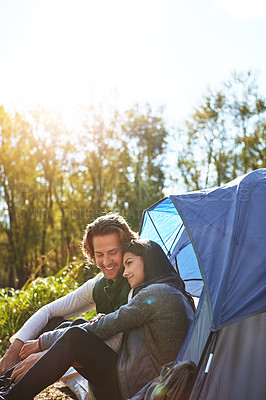 Buy stock photo Shot of an adventurous young couple at their campsite