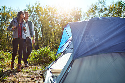 Buy stock photo Shot of an adventurous young couple at their campsite