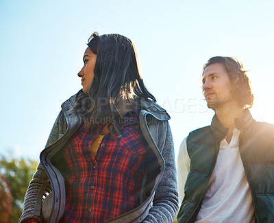 Buy stock photo Shot of an adventurous young couple at their campsite