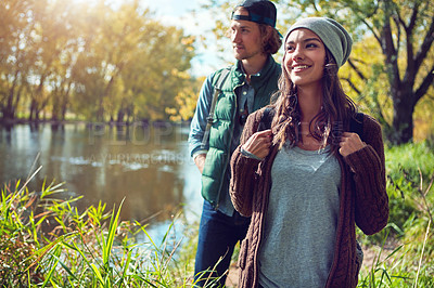 Buy stock photo Cropped shot of an affectionate young couple spending a day in nature