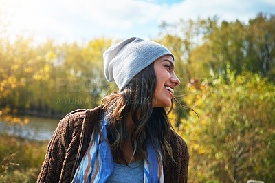 Buy stock photo Shot of a young woman enjoying a day outdoors