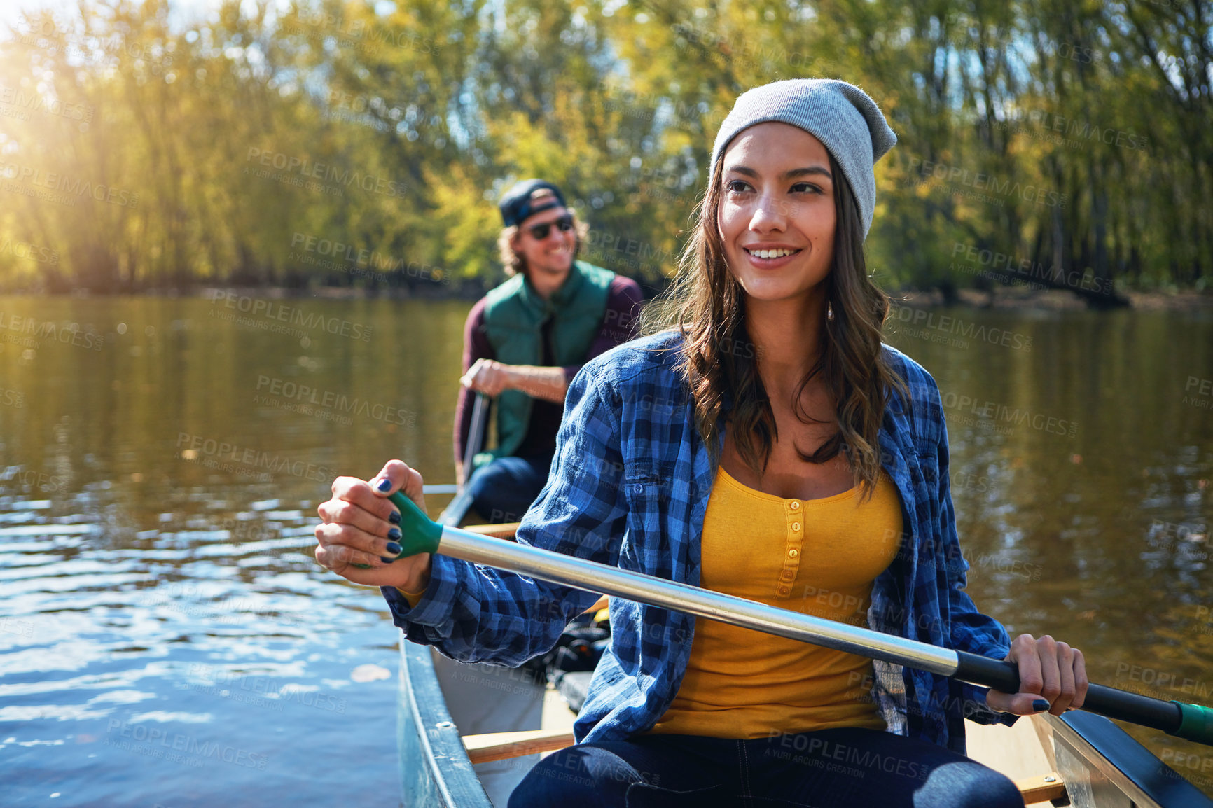 Buy stock photo Lake, canoe and couple with nature, love and happiness with romance, relationship or bonding together. Water, river or man with woman, environment or getaway trip with weekend break, holiday or smile