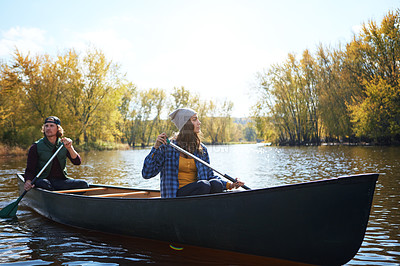 Buy stock photo Couple, canoe and lake rowing in wood for exploring nature or teamwork for healthy morning, travel or journey. Man, woman and camp site in Colorado or forest weekend for autumn trip, weekend or calm