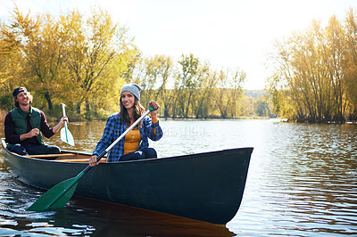 Buy stock photo Portrait of a young couple going for a canoe ride on the lake