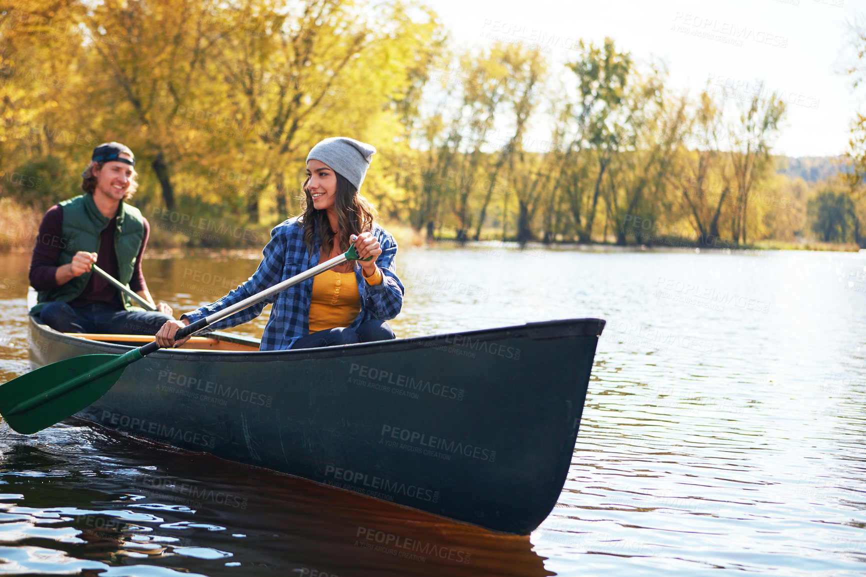 Buy stock photo Lake, canoe and couple with nature, adventure and hobby with vacation, happiness and bonding together. River, man or woman with activity, honeymoon or travel with journey, Canada or summer with kayak