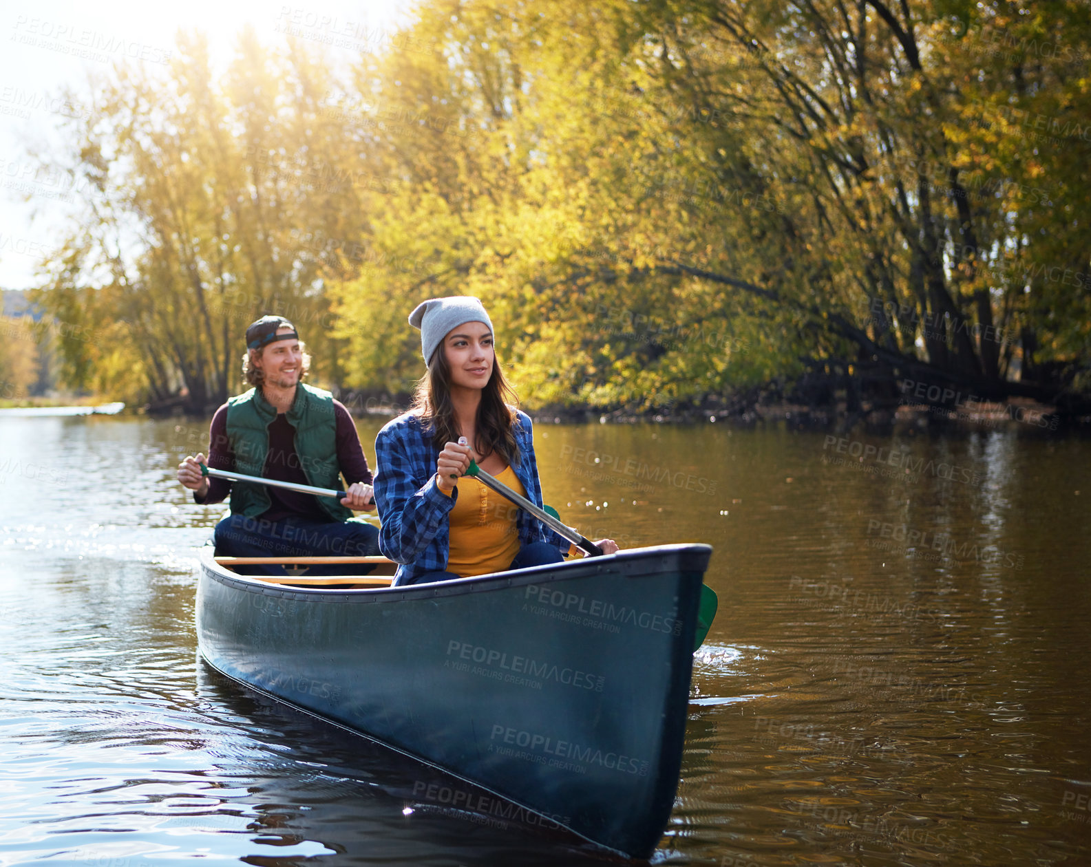 Buy stock photo Outdoor, canoeing and couple in boat on lake for vacation, bonding or getaway together with hobby. River, nature and people for rowing challenge with kayaking adventure on holiday or weekend trip.
