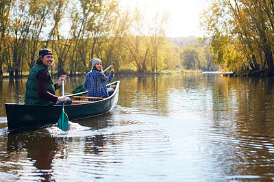 Buy stock photo Portrait of a young couple going for a canoe ride on the lake