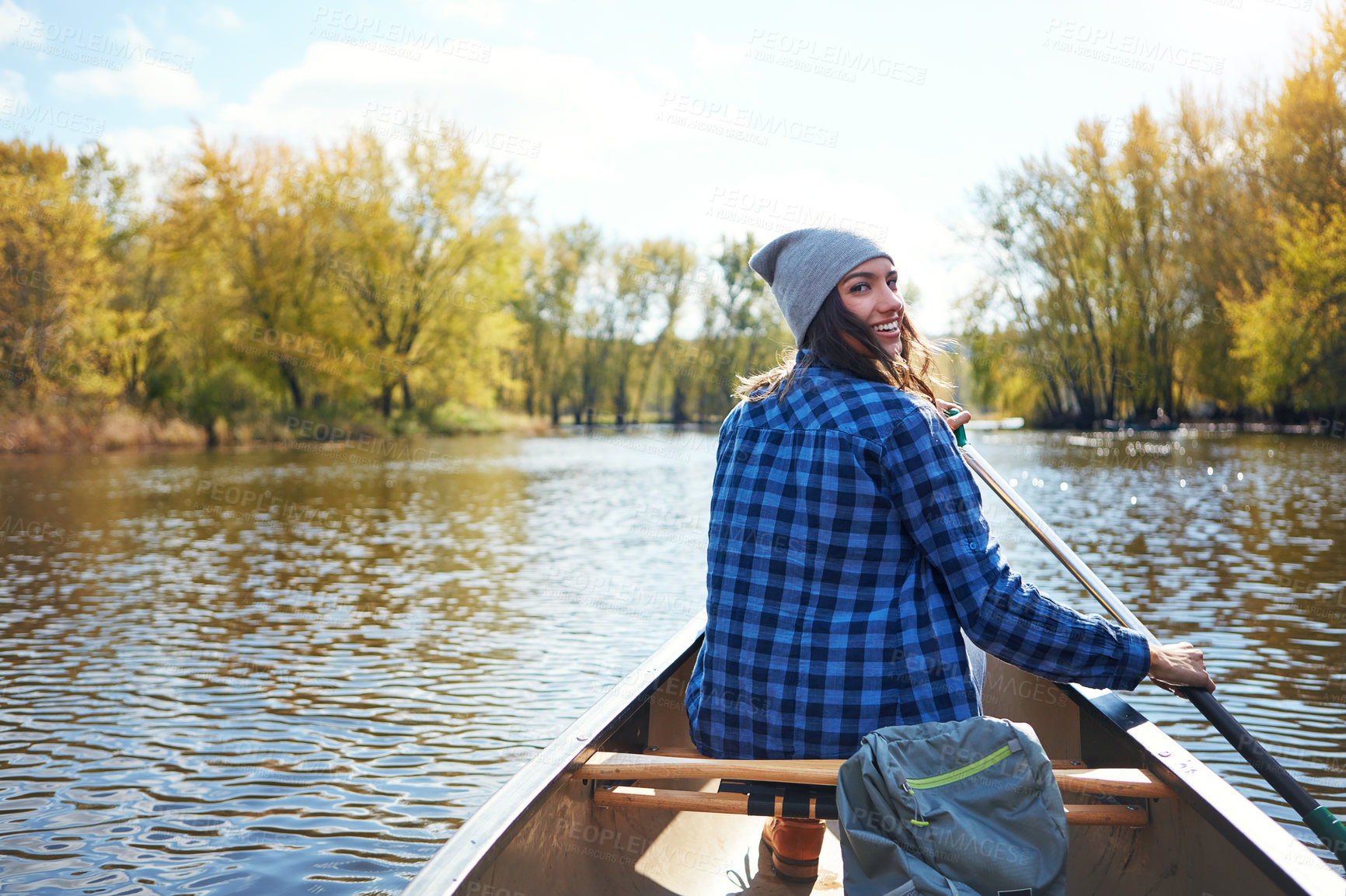 Buy stock photo Back, river and woman in canoe, portrait and excited with hobby, countryside and relax. Lake, adventure and person with happiness, water activity and row boat with kayak, explore and weekend break