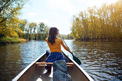 Buy stock photo Woman, back and kayaking in nature on lake, wellness hobby and backpack for supplies with paddle for rowing. Vacation, relax and explore exercise on travel holiday, kayak boat and trees on riverbank