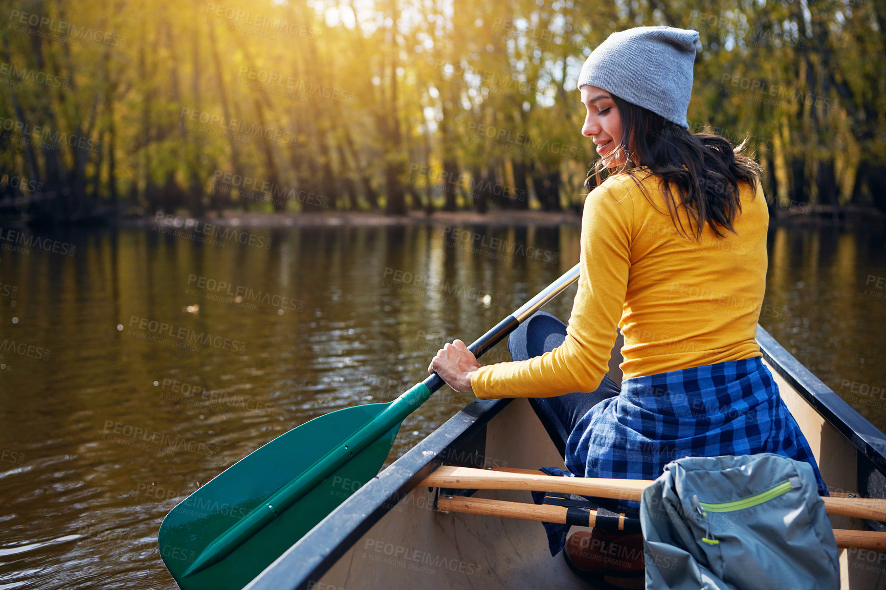 Buy stock photo Woman, back and canoeing in nature on water, wellness hobby and backpack for supplies with paddle for rowing. Vacation, relax and explore exercise on travel holiday, canoe boat and trees on river