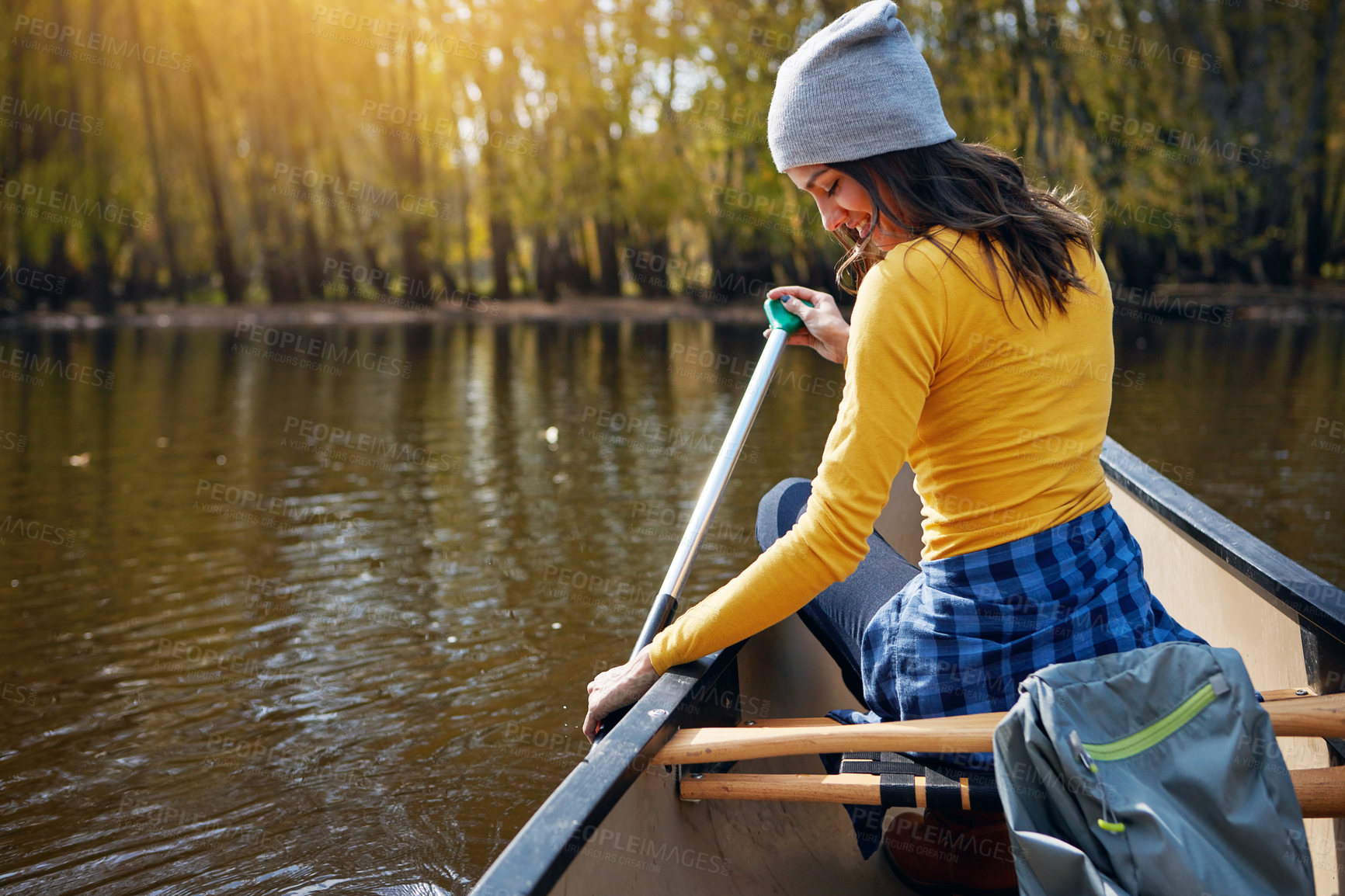 Buy stock photo Woman, back and canoeing in nature on river, wellness hobby and backpack for supplies with paddle for rowing. Vacation, relax and explore exercise on travel holiday, canoe boat and trees on lake