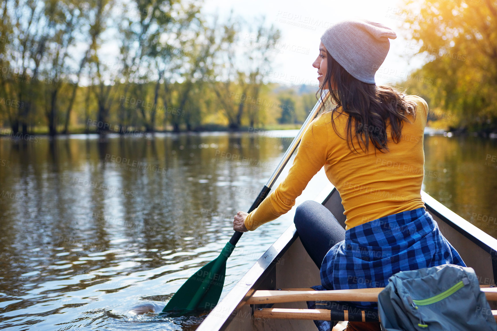 Buy stock photo Woman, back and canoeing for water sport in nature, wellness hobby and single blade paddle for rowing. Vacation, relax and explore exercise on travel for summer holiday, canoe boat and trees on river