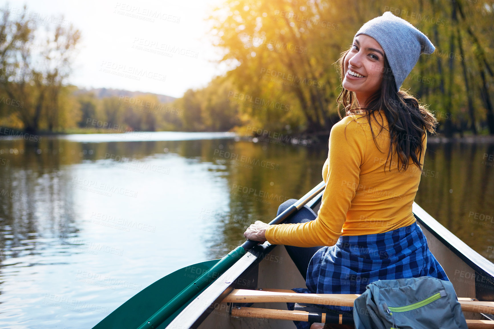 Buy stock photo Woman, back and canoeing for water portrait in nature, wellness hobby and single blade paddle for rowing. Vacation, relax and explore exercise on travel in summer, canoe boat and trees on river