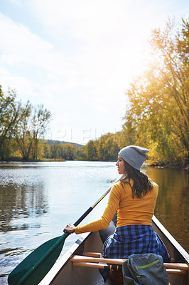 Buy stock photo Woman, back and canoeing in forest on water, wellness hobby and backpack for supplies with paddle for rowing. Vacation, relax and explore exercise on travel holiday, canoe boat and trees on river