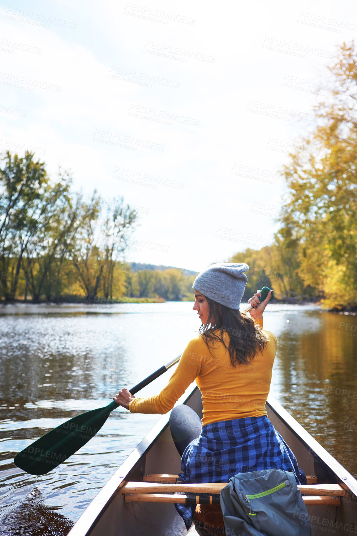 Buy stock photo Woman, back and canoe in forest on water, wellness hobby and backpack for supplies with paddle for rowing. Vacation, relax and explore exercise on travel holiday, canoeing boat and trees on river