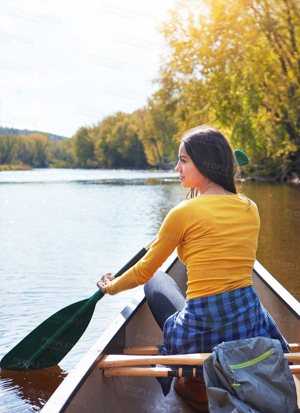 Buy stock photo Woman, back and canoeing paddle in nature on lake, wellness hobby and backpack for supplies and rowing for water sport. Vacation, relax and explore exercise on travel holiday, canoe boat and trees