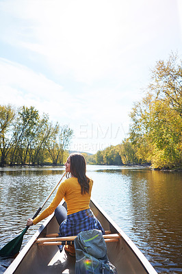 Buy stock photo Woman, back and canoeing paddle in forest on lake, wellness hobby and backpack for supplies and rowing for water sport. Vacation, relax and explore exercise on travel holiday, canoe boat and trees