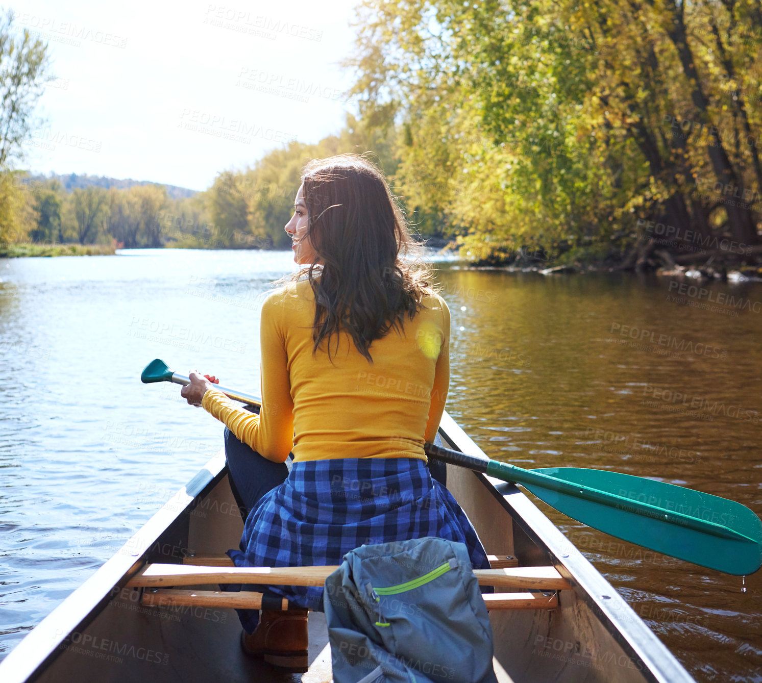 Buy stock photo Woman, back and canoeing for fitness on water, wellness hobby and backpack for supplies with paddle for rowing. Vacation, relax and explore exercise on travel holiday, canoe boat and trees on river