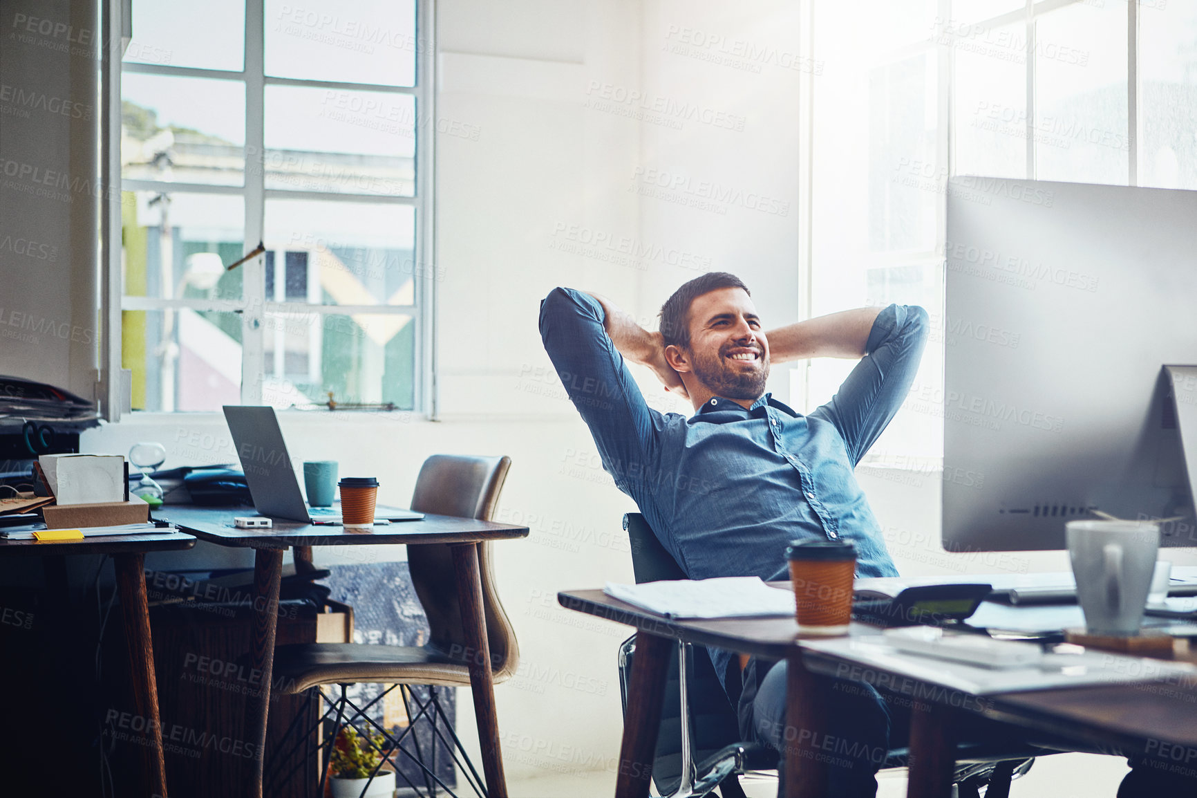 Buy stock photo Smile, relax and happy man at office desk for stretching, productivity or done with project. Break, computer and employee with arms behind head for satisfied, achievement or deadline complete