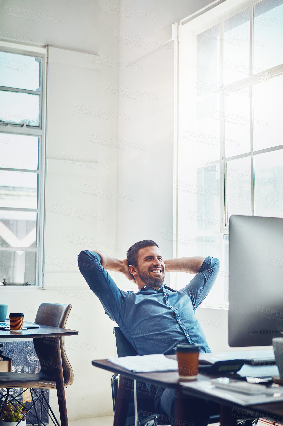 Buy stock photo Smile, break and happy man at office desk for stretching, productivity or done with project. Relax, computer and employee with arms behind head for satisfied, achievement or deadline complete
